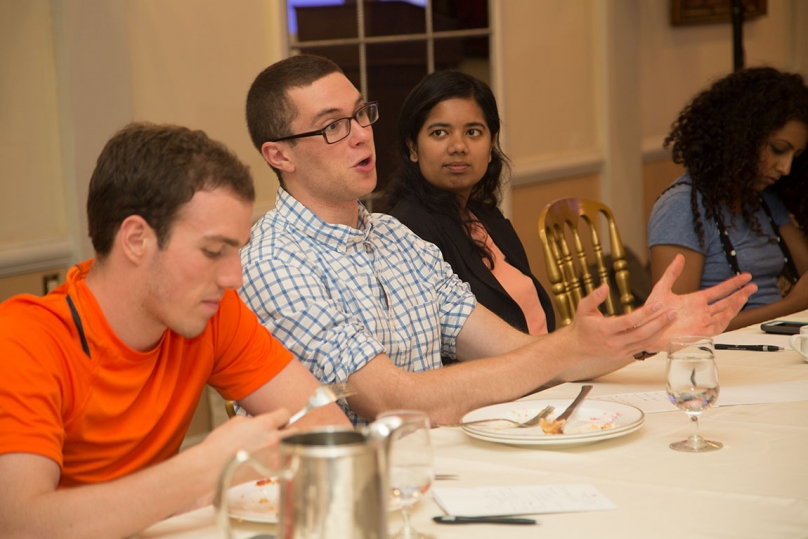 Junior Raoul Rodriguez, left, senior Aaron Schwartz, middle, and junior Simran Mathews, right, participate in a conversation at the talk by Gupta.