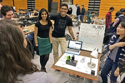 A team from Carnegie Mellon University created an alarm clock that mists water onto a sleeper if not shut off in time. For deep sleepers, the device escalates to posting embarrassing status updates on social media and finally blasts a car horn if the person doesn't wake up and shut it off. (Photo by Steven Schultz, Office of Engineering Communications)